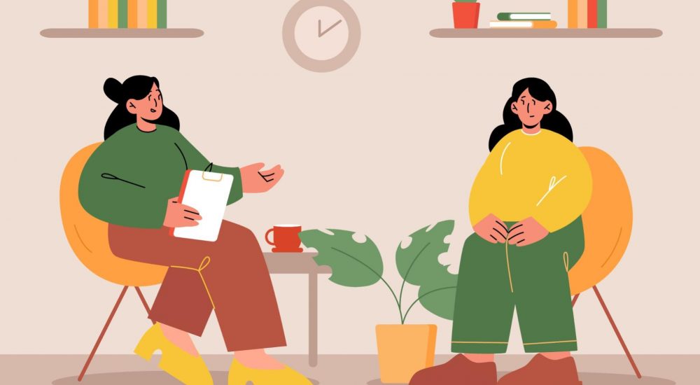 Therapist counseling a client during a private mental health session.